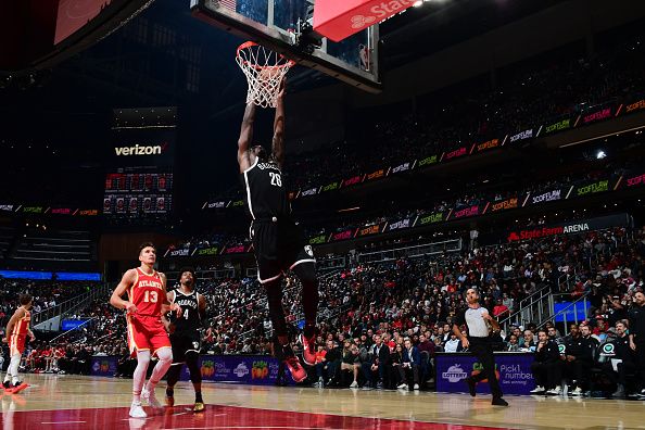 ATLANTA, GA - DECEMBER 6: Dorian Finney-Smith #28 of the Brooklyn Nets dunks the ball during the game against the Atlanta Hawks on December 6, 2023 at State Farm Arena in Atlanta, Georgia.  NOTE TO USER: User expressly acknowledges and agrees that, by downloading and/or using this Photograph, user is consenting to the terms and conditions of the Getty Images License Agreement. Mandatory Copyright Notice: Copyright 2023 NBAE (Photo by Scott Cunningham/NBAE via Getty Images)