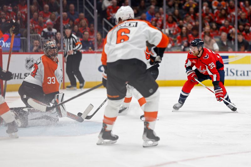 Mar 1, 2024; Washington, District of Columbia, USA; Washington Capitals right wing Anthony Mantha (39) scores a goal on Philadelphia Flyers goaltender Samuel Ersson (33) in the third period at Capital One Arena. Mandatory Credit: Geoff Burke-USA TODAY Sports