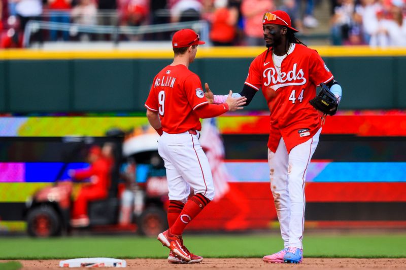 May 24, 2025; Cincinnati, Ohio, USA; Cincinnati Reds second baseman Matt McLain (9) shakes hands with shortstop Elly De La Cruz (44) after the victory over the Chicago Cubs at Great American Ball Park. Mandatory Credit: Katie Stratman-Imagn Images