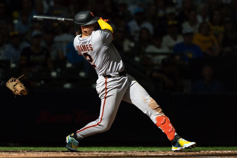 Aug 24, 2025; Milwaukee, Wisconsin, USA;  San Francisco Giants shortstop Willy Adames (2) singles during the eighth inning against the Milwaukee Brewers at American Family Field. Mandatory Credit: Jeff Hanisch-Imagn Images