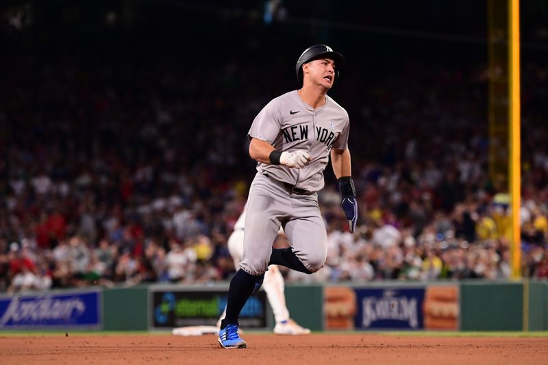 Jun 16, 2024; Boston, Massachusetts, USA; New York Yankees shortstop Anthony Volpe (11) runs to third base during the sixth inning against the Boston Red Sox at Fenway Park. Mandatory Credit: Eric Canha-USA TODAY Sports