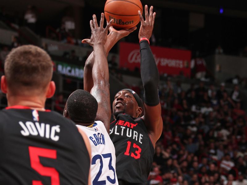 MIAMI, FL - MARCH 26:  Bam Adebayo #13 of the Miami Heat shoots the ball during the game against the Golden State Warriors on March 26, 2024 at Kaseya Center in Miami, Florida. NOTE TO USER: User expressly acknowledges and agrees that, by downloading and or using this Photograph, user is consenting to the terms and conditions of the Getty Images License Agreement. Mandatory Copyright Notice: Copyright 2024 NBAE (Photo by Issac Baldizon/NBAE via Getty Images)