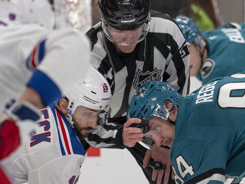 Jan 23, 2026; San Jose, California, USA;  New York Rangers center Vincent Trocheck (16) and San Jose Sharks left wing Pavol Regenda (84) fight for the puck drop by the referee during the second period at SAP Center at San Jose. Mandatory Credit: Stan Szeto-Imagn Images