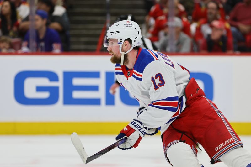 May 26, 2024; Sunrise, Florida, USA; New York Rangers left wing Alexis Lafrenière (13) looks on against the Florida Panthers during the first period in game three of the Eastern Conference Final of the 2024 Stanley Cup Playoffs at Amerant Bank Arena. Mandatory Credit: Sam Navarro-USA TODAY Sports