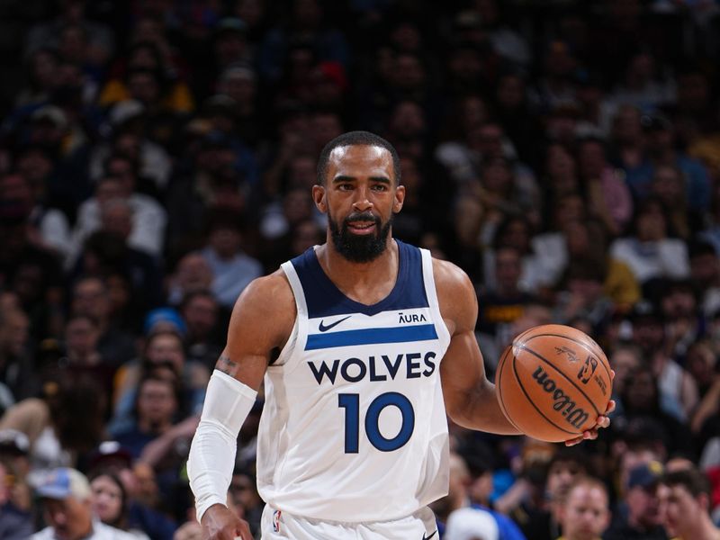 DENVER, CO - APRIL 10:Mike Conley #10 of the Minnesota Timberwolves dribbles the ball during the game against the Denver Nuggets  on April 10, 2024 at the Ball Arena in Denver, Colorado. NOTE TO USER: User expressly acknowledges and agrees that, by downloading and/or using this Photograph, user is consenting to the terms and conditions of the Getty Images License Agreement. Mandatory Copyright Notice: Copyright 2024 NBAE (Photo by Garrett Ellwood/NBAE via Getty Images)