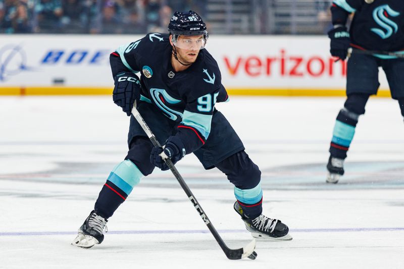 Oct 19, 2024; Seattle, Washington, USA; Seattle Kraken left wing Andre Burakovsky (95) skates against the Calgary Flames during the first period at Climate Pledge Arena. Mandatory Credit: Caean Couto-Imagn Images