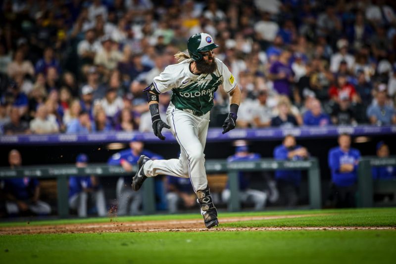 Sep 14, 2024; Denver, Colorado, USA; Colorado Rockies outfielder Hunter Goodman (15) runs to first during the Rockies game against the Chicago Cubs at Coors Field. Mandatory Credit: Chet Strange-Imagn Images