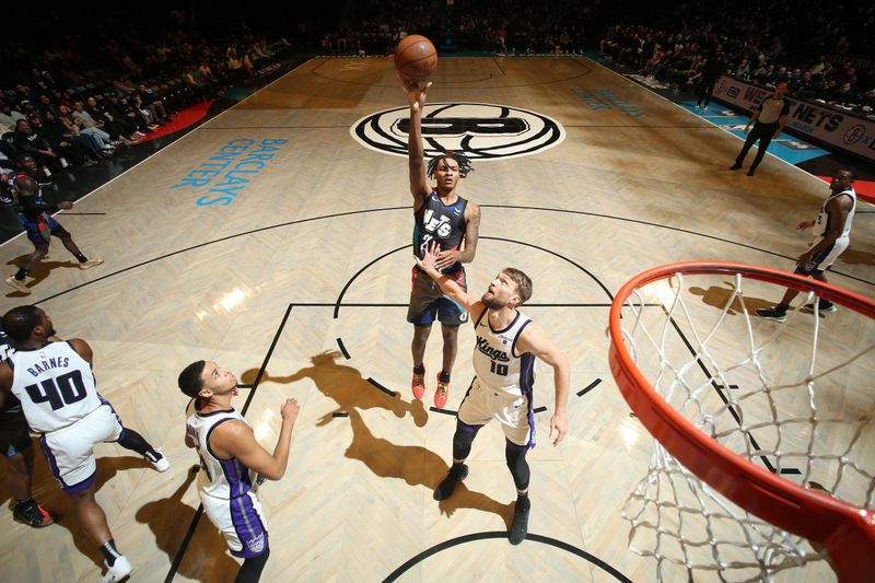 BROOKLYN, NY - APRIL 7: Noah Clowney #21 of the Brooklyn Nets shoots the ball during the game against the Sacramento Kings on April 7, 2024 at Barclays Center in Brooklyn, New York. NOTE TO USER: User expressly acknowledges and agrees that, by downloading and or using this Photograph, user is consenting to the terms and conditions of the Getty Images License Agreement. Mandatory Copyright Notice: Copyright 2024 NBAE (Photo by Nathaniel S. Butler/NBAE via Getty Images)