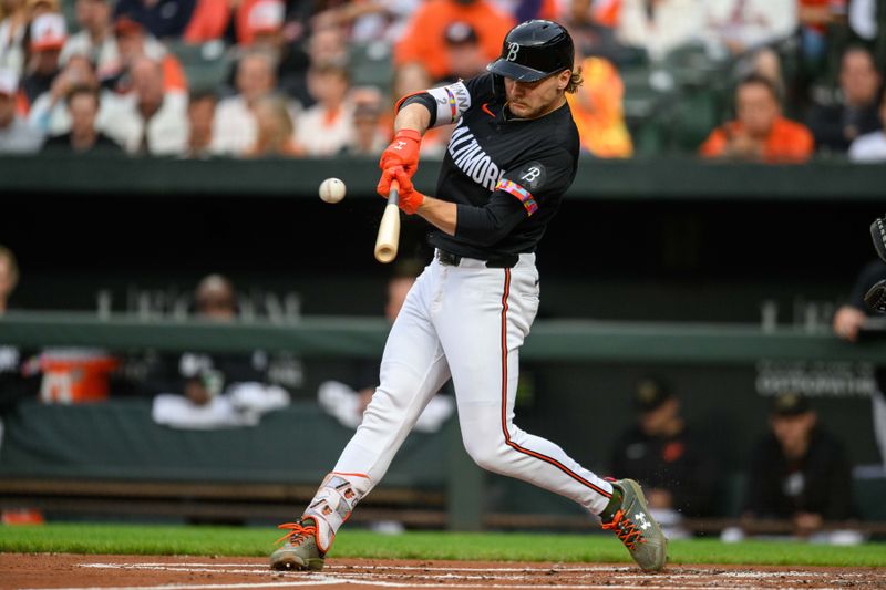 May 17, 2024; Baltimore, Maryland, USA; Baltimore Orioles shortstop Gunnar Henderson (2) hits a home run during the first inning against the Seattle Mariners at Oriole Park at Camden Yards. Mandatory Credit: Reggie Hildred-USA TODAY Sports