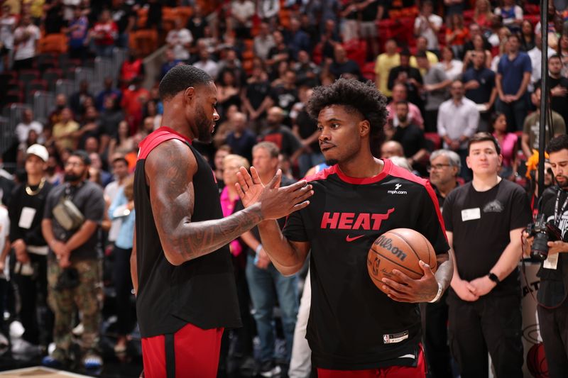 MIAMI, FL - MARCH 2: Haywood Highsmith #24 and Davion Mitchell #45 of the Miami Heat high five before the game against the New York Knicks on March 2, 2025 at Kaseya Center in Miami, Florida. NOTE TO USER: User expressly acknowledges and agrees that, by downloading and or using this Photograph, user is consenting to the terms and conditions of the Getty Images License Agreement. Mandatory Copyright Notice: Copyright 2025 NBAE (Photo by Issac Baldizon/NBAE via Getty Images)