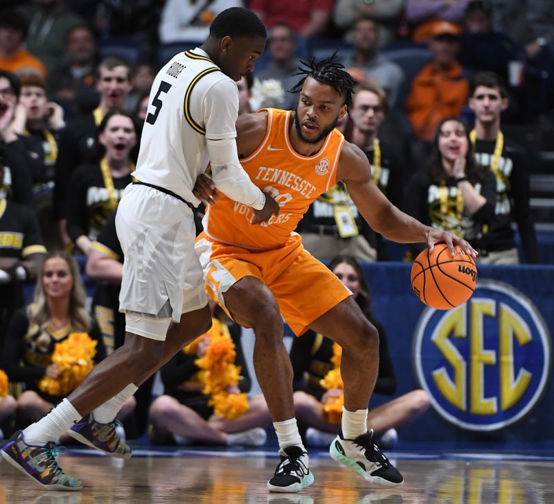 Mar 10, 2023; Nashville, TN, USA; Tennessee Volunteers guard Josiah-Jordan James (30) works against Missouri Tigers guard D'Moi Hodge (5) during the first half at Bridgestone Arena. Mandatory Credit: Christopher Hanewinckel-USA TODAY Sports