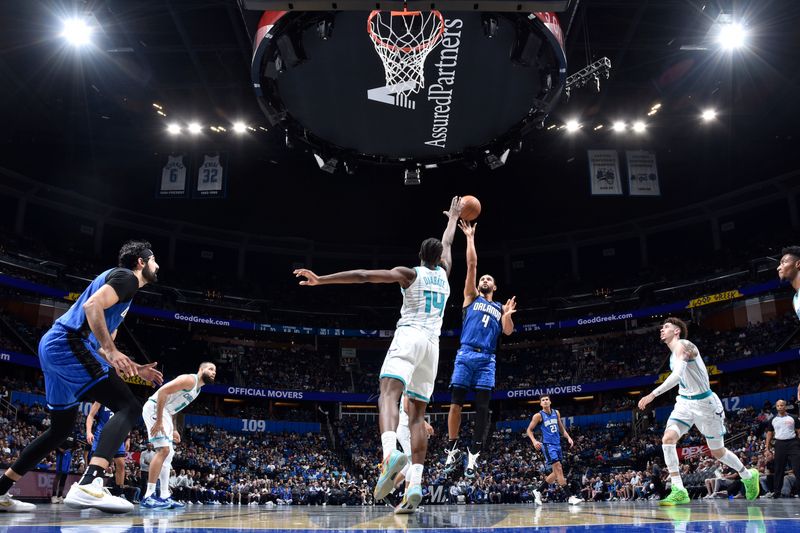 ORLANDO, FL - NOVEMBER 12: Jalen Suggs #4 of the Orlando Magic shoots the ball during the Emirates NBA Cup game on November 12, 2024 at Kia Center in Orlando, Florida. NOTE TO USER: User expressly acknowledges and agrees that, by downloading and or using this photograph, User is consenting to the terms and conditions of the Getty Images License Agreement. Mandatory Copyright Notice: Copyright 2024 NBAE (Photo by Fernando Medina/NBAE via Getty Images)