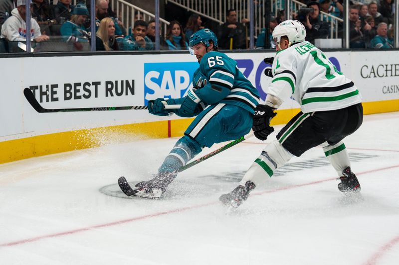 Jan 18, 2023; San Jose, California, USA;  San Jose Sharks defenseman Erik Karlsson (65) and Dallas Stars center Luke Glendening (11) battle for position for the puck during the third period at SAP Center at San Jose. Mandatory Credit: Neville E. Guard-USA TODAY Sports