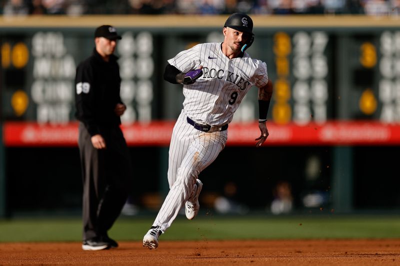 Jun 18, 2024; Denver, Colorado, USA; Colorado Rockies center fielder Brenton Doyle (9) runs to third in the first inning against the Los Angeles Dodgers at Coors Field. Mandatory Credit: Isaiah J. Downing-USA TODAY Sports