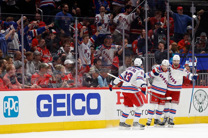 Apr 28, 2024; Washington, District of Columbia, USA; New York Rangers left wing Artemi Panarin (10) celebrates with teammates after scoring a goal against the Washington Capitals in the third period in game four of the first round of the 2024 Stanley Cup Playoffs at Capital One Arena. Mandatory Credit: Geoff Burke-USA TODAY Sports