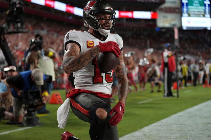 Tampa Bay Buccaneers wide receiver Mike Evans (13) looks around after making a touchdown reception during an NFL football game against the ,Kansas City Chiefs Sunday, October 2, 2022 in Tampa, FL. The Chiefs defeat the Buccaneers 41-31. (Peter Joneleit via AP)