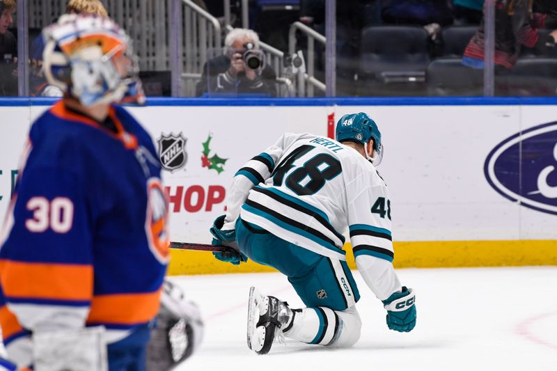 Dec 5, 2023; Elmont, New York, USA; San Jose Sharks center Tomas Hertl (48) scores a game tying goal against the New York Islanders during the third period at UBS Arena. Mandatory Credit: Dennis Schneidler-USA TODAY Sports