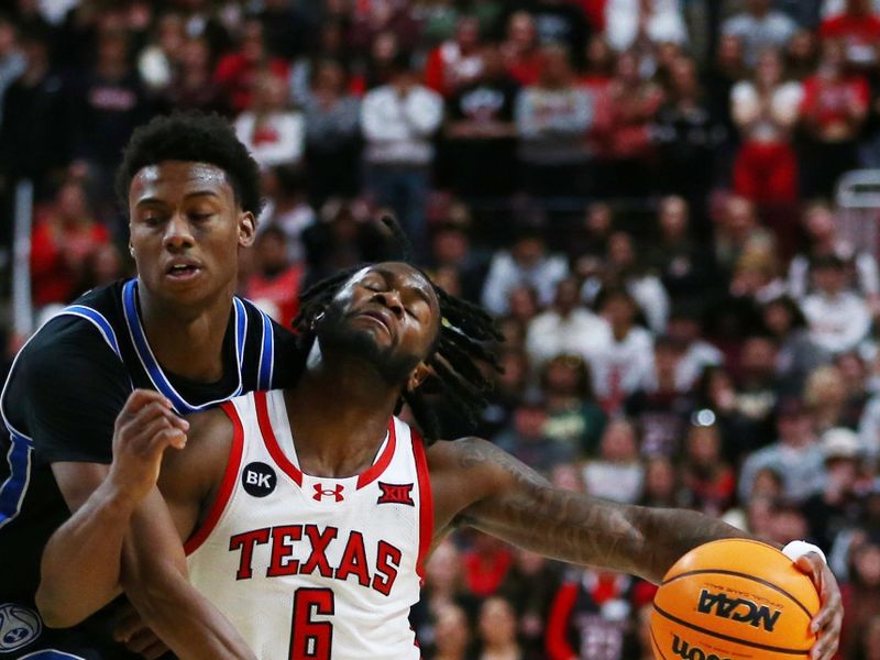 Jan 20, 2024; Lubbock, Texas, USA;  Texas Tech Red Raiders guard Joe Toussaint (6) is fouled by Brigham Young Cougars guard Jaxson Robinson (2) in the second half at United Supermarkets Arena. Mandatory Credit: Michael C. Johnson-USA TODAY Sports