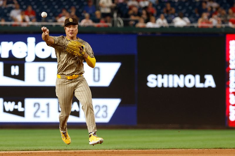Jul 23, 2024; Washington, District of Columbia, USA; San Diego Padres shortstop Ha-Seong Kim (7) makes a throw to third base on fielders choice by Washington Nationals outfielder James Wood (not pictured) during the seventh inning by at Nationals Park. Mandatory Credit: Geoff Burke-USA TODAY Sports