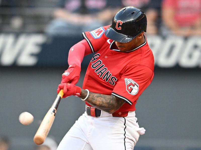 Sep 28, 2025; Cleveland, Ohio, USA;  Cleveland Guardians shortstop Brayan Rocchio (4) hits a three run home run to win the game in the tenth inning against the Texas Rangers at Progressive Field. Mandatory Credit: Ken Blaze-Imagn Images
