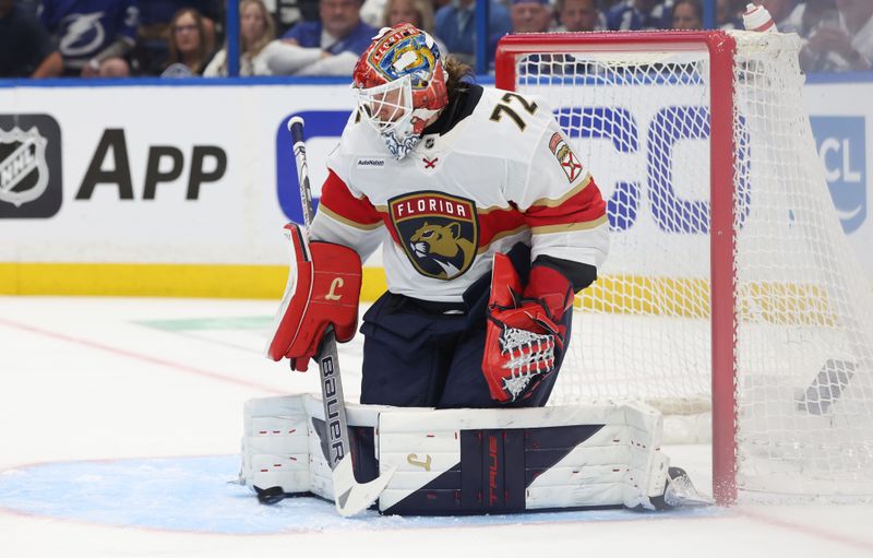 Apr 30, 2025; Tampa, Florida, USA; Florida Panthers goaltender Sergei Bobrovsky (72) makes a save against the Tampa Bay Lightning during the first period of game five of the first round of the 2025 Stanley Cup Playoffs at Amalie Arena. Mandatory Credit: Kim Klement Neitzel-Imagn Images