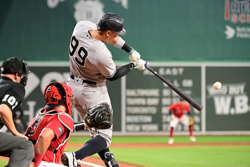 Sep 14, 2023; Boston, Massachusetts, USA; New York Yankees designated hitter Aaron Judge (99) hits a three run home run during the second inning against the Boston Red Sox at Fenway Park. Mandatory Credit: Eric Canha-USA TODAY Sports