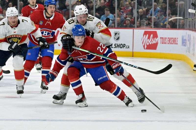 Apr 2, 2024; Montreal, Quebec, CAN; Montreal Canadiens forward Cole Caufield (22) plays the puck and Florida Panthers forward Vladimir Tarasenko (10) defends during the second period at the Bell Centre. Mandatory Credit: Eric Bolte-USA TODAY Sports