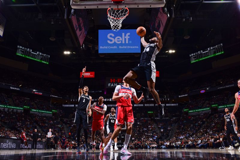 SAN ANTONIO, TX - NOVEMBER 13: Blake Wesley #14 of the San Antonio Spurs dunks the ball during the game against the Washington Wizards on November 13, 2024 at the Frost Bank Center in San Antonio, Texas. NOTE TO USER: User expressly acknowledges and agrees that, by downloading and or using this photograph, user is consenting to the terms and conditions of the Getty Images License Agreement. Mandatory Copyright Notice: Copyright 2024 NBAE (Photos byGarrett Ellwood/NBAE via Getty Images)