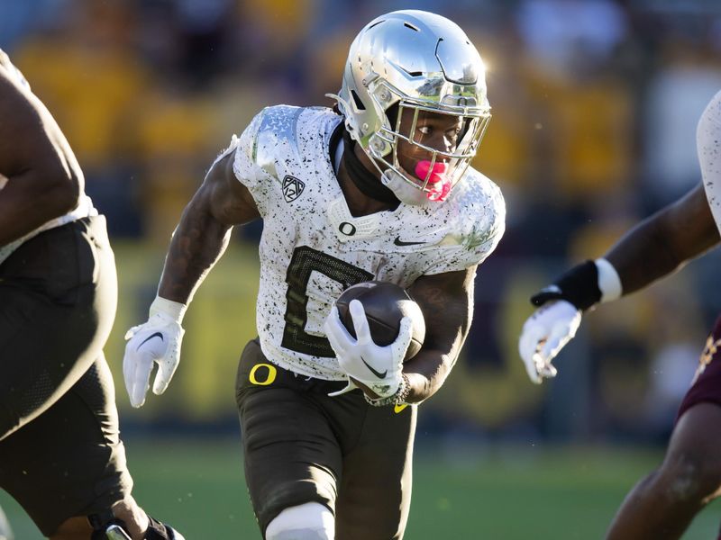 Nov 18, 2023; Tempe, Arizona, USA; Oregon Ducks running back Bucky Irving (0) against the Arizona State Sun Devils at Mountain America Stadium. Mandatory Credit: Mark J. Rebilas-USA TODAY Sports