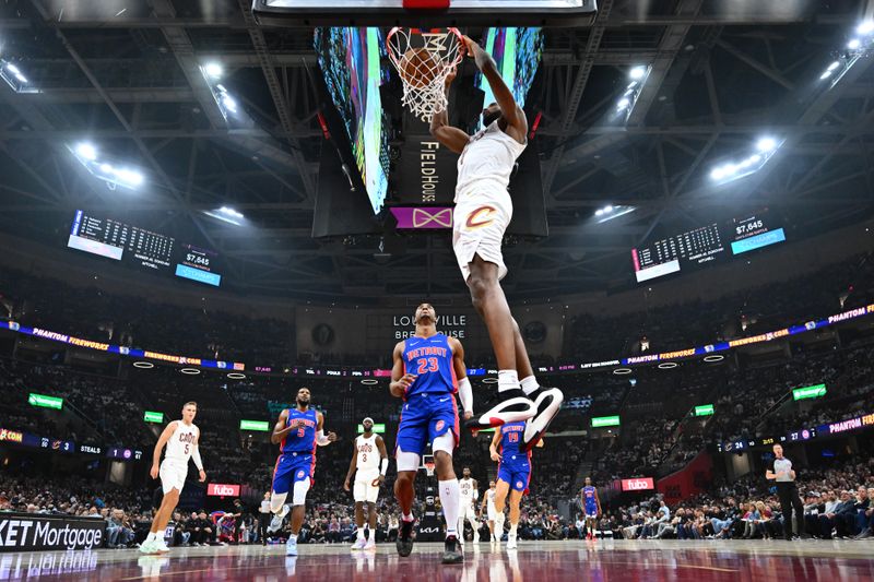 CLEVELAND, OHIO - OCTOBER 25: Evan Mobley #4 of the Cleveland Cavaliers dunks over Jaden Ivey #23 of the Detroit Pistons during the second quarter at Rocket Mortgage Fieldhouse on October 25, 2024 in Cleveland, Ohio. The Cavaliers defeated the Pistons 113-101. NOTE TO USER: User expressly acknowledges and agrees that, by downloading and or using this photograph, User is consenting to the terms and conditions of the Getty Images License Agreement. (Photo by Jason Miller/Getty Images)