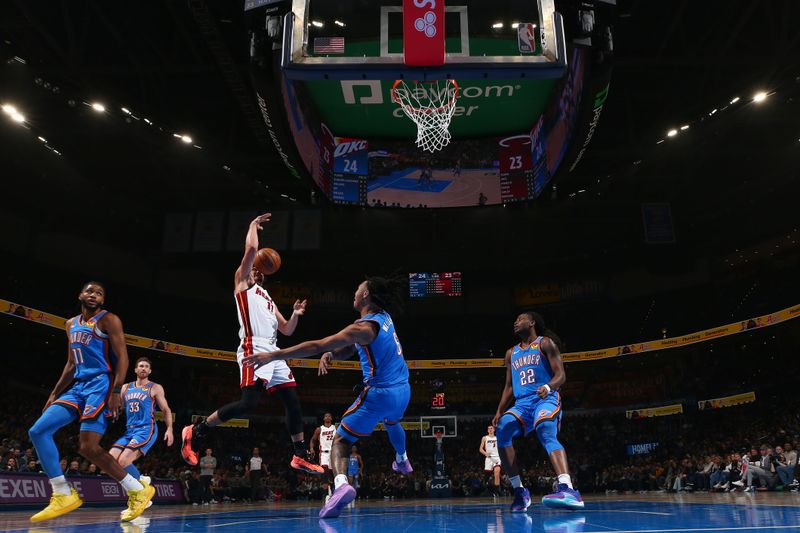 OKLAHOMA CITY, OK - MARCH 8:  Jaime Jaquez Jr. #11 of the Miami Heat loses control of the ball during the game against the Oklahoma City Thunder on March 8, 2024 at Paycom Arena in Oklahoma City, Oklahoma. NOTE TO USER: User expressly acknowledges and agrees that, by downloading and or using this photograph, User is consenting to the terms and conditions of the Getty Images License Agreement. Mandatory Copyright Notice: Copyright 2024 NBAE (Photo by Zach Beeker/NBAE via Getty Images)