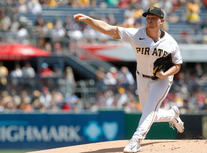 Aug 13, 2023; Pittsburgh, Pennsylvania, USA; Pittsburgh Pirates starting pitcher Mitch Keller (23) delivers a pitch against the Cincinnati Reds during the first inning at PNC Park. Mandatory Credit: Charles LeClaire-USA TODAY Sports