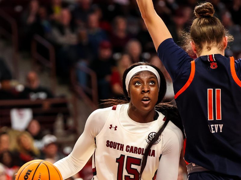 Jan 5, 2023; Columbia, South Carolina, USA; South Carolina Gamecocks forward Laeticia Amihere (15) drives around Auburn Tigers forward Romi Levy (11) in the first half at Colonial Life Arena. Mandatory Credit: Jeff Blake-USA TODAY Sports