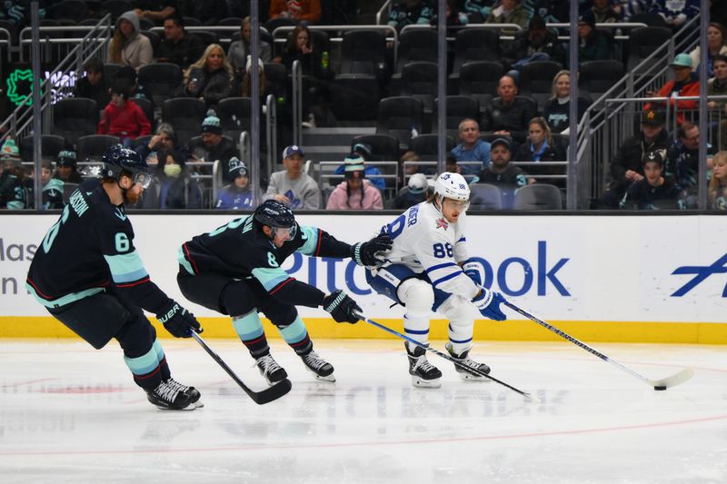 Jan 21, 2024; Seattle, Washington, USA; Toronto Maple Leafs right wing William Nylander (88) advances the puck while defended by Seattle Kraken defenseman Brian Dumoulin (8) during the third period at Climate Pledge Arena. Mandatory Credit: Steven Bisig-USA TODAY Sports