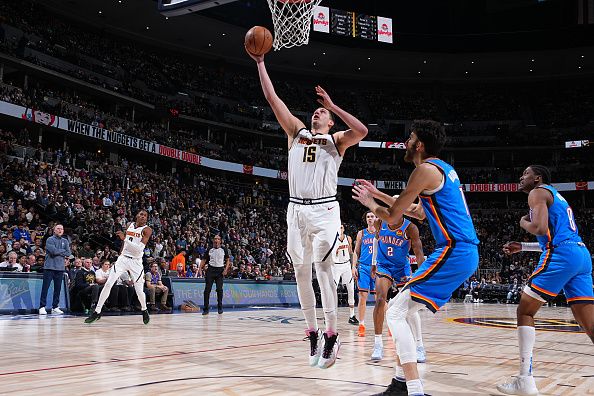 DENVER, CO - DECEMBER 29: Nikola Jokic #15 of the Denver Nuggets drives to the basket during the game against the Oklahoma City Thunder on December 29, 2023 at the Ball Arena in Denver, Colorado. NOTE TO USER: User expressly acknowledges and agrees that, by downloading and/or using this Photograph, user is consenting to the terms and conditions of the Getty Images License Agreement. Mandatory Copyright Notice: Copyright 2023 NBAE (Photo by Garrett Ellwood/NBAE via Getty Images)