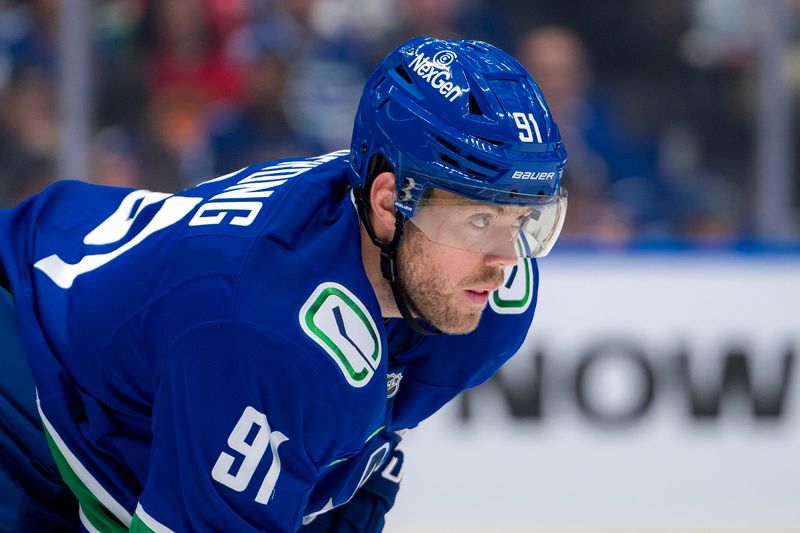 Oct 4, 2024; Vancouver, British Columbia, CAN; Vancouver Canucks forward Daniel Sprong (91) prepares for a face off against the Edmonton Oilers during the second period at Rogers Arena. Mandatory Credit: Bob Frid-Imagn Images