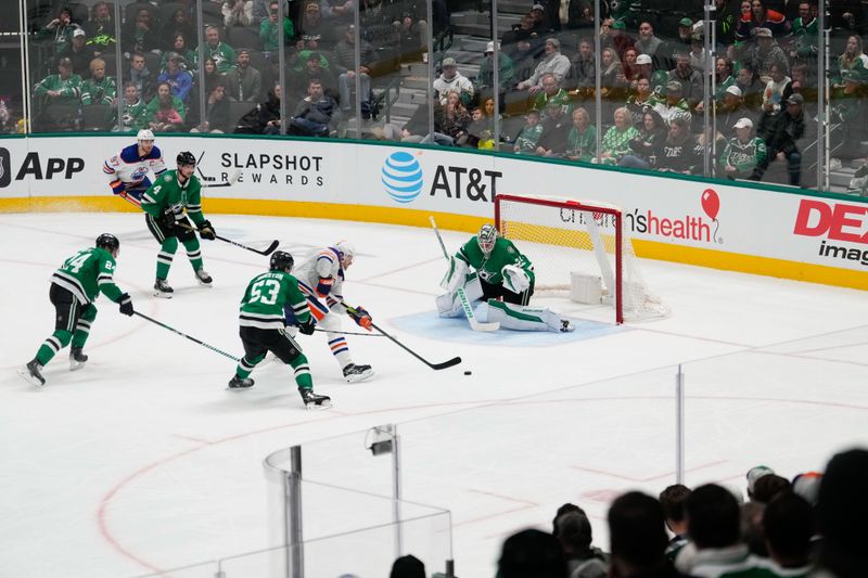 Feb 17, 2024; Dallas, Texas, USA;  Dallas Stars center Wyatt Johnston (53) is called for hooking against Edmonton Oilers center Leon Draisaitl (29) during the overtime period at American Airlines Center. Mandatory Credit: Chris Jones-USA TODAY Sports