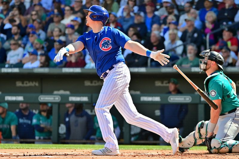 Mar 8, 2024; Mesa, Arizona, USA;  Chicago Cubs designated hitter Garrett Cooper (41) hits a three run home run in the first inning against the Seattle Mariners during a spring training game at Sloan Park. Mandatory Credit: Matt Kartozian-USA TODAY Sports