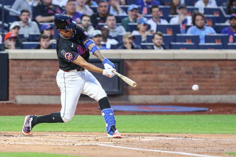 Apr 22, 2025; New York City, New York, USA;  New York Mets third baseman Mark Vientos (27) hits an RBI double in the first inning against the Philadelphia Phillies at Citi Field. Mandatory Credit: Wendell Cruz-Imagn Images
