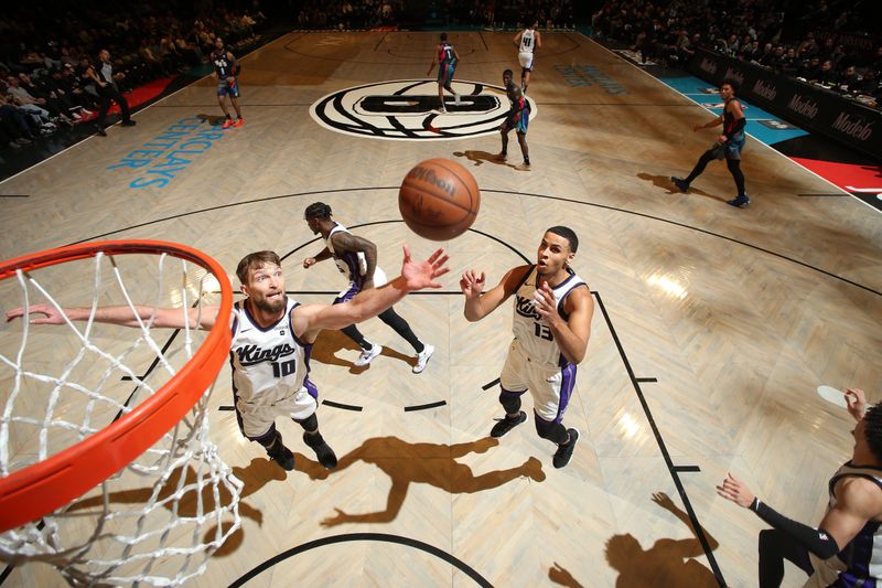 BROOKLYN, NY - APRIL 7: Domantas Sabonis #10 of the Sacramento Kings reaches for a rebound during the game against the Brooklyn Nets on April 7, 2024 at Barclays Center in Brooklyn, New York. NOTE TO USER: User expressly acknowledges and agrees that, by downloading and or using this Photograph, user is consenting to the terms and conditions of the Getty Images License Agreement. Mandatory Copyright Notice: Copyright 2024 NBAE (Photo by Nathaniel S. Butler/NBAE via Getty Images)