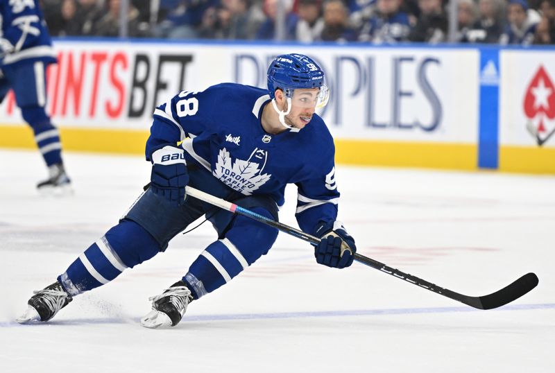 Jan 17, 2023; Toronto, Ontario, CAN;   Toronto Maple Leafs forward Michael Bunting (58) pursues the play against the Florida Panthers in the third period at Scotiabank Arena. Mandatory Credit: Dan Hamilton-USA TODAY Sports