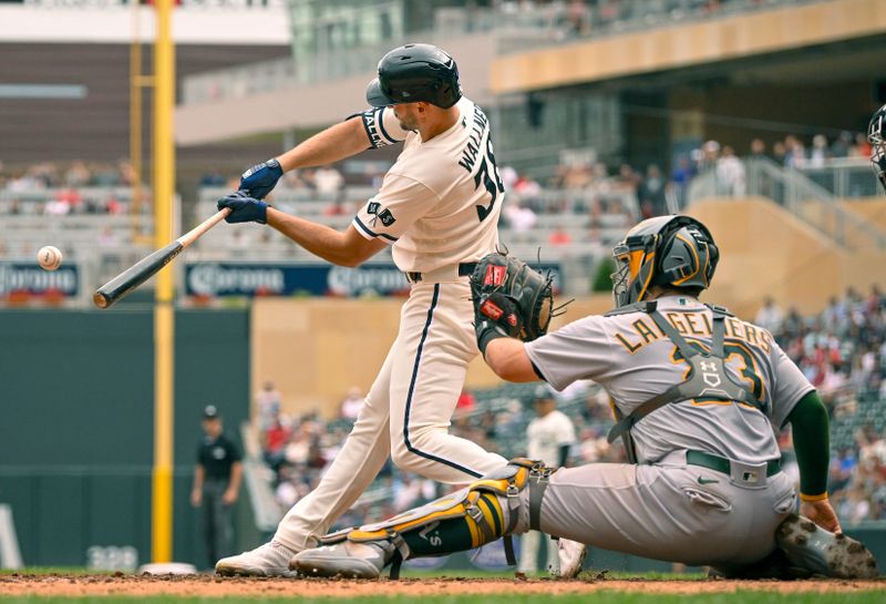 Sep 28, 2023; Minneapolis, Minnesota, USA; Minnesota Twins outfielder Matt Wallner (38) drives in a run against the Oakland Athletics on a fielder s choice during the sixth inning at Target Field. Mandatory Credit: Nick Wosika-USA TODAY Sports