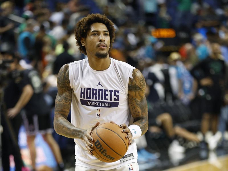 GREENSBORO, NORTH CAROLINA - OCTOBER 07: Kelly Oubre Jr. #12 of the Charlotte Hornets warms up prior to the game against the Boston Celtics at Greensboro Coliseum Complex on October 07, 2022 in Greensboro, North Carolina. NOTE TO USER: User expressly acknowledges and agrees that, by downloading and or using this photograph, User is consenting to the terms and conditions of the Getty Images License Agreement. (Photo by Jared C. Tilton/Getty Images)