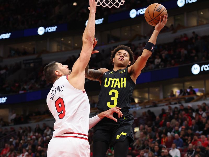 CHICAGO, ILLINOIS - NOVEMBER 06: Keyonte George #3 of the Utah Jazz goes up for a layup against Nikola Vucevic #9 of the Chicago Bulls during the second half at the United Center on November 06, 2023 in Chicago, Illinois. NOTE TO USER: User expressly acknowledges and agrees that, by downloading and or using this photograph, User is consenting to the terms and conditions of the Getty Images License Agreement. (Photo by Michael Reaves/Getty Images)