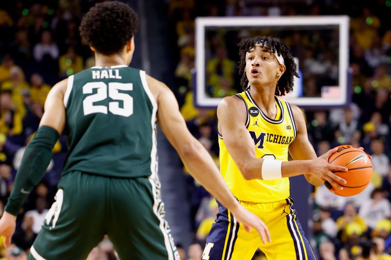 Feb 18, 2023; Ann Arbor, Michigan, USA;  Michigan Wolverines guard Kobe Bufkin (2) controls the ball against Michigan State Spartans forward Malik Hall (25) in the first half at Crisler Center. Mandatory Credit: Rick Osentoski-USA TODAY Sports