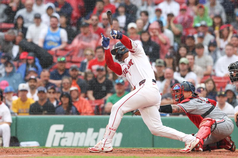 May 4, 2025; Boston, Massachusetts, USA; Boston Red Sox catcher Carlos Narvaez (75) hits a two run RBI single during the second inning against the Minnesota Twins at Fenway Park. Mandatory Credit: Paul Rutherford-Imagn Images