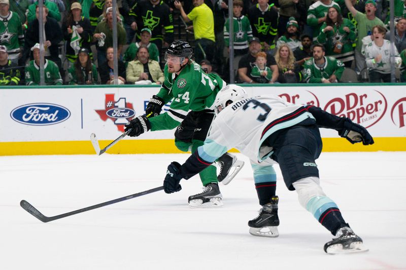 May 15, 2023; Dallas, Texas, USA; Dallas Stars center Roope Hintz (24) scores on a breakaway shot past Seattle Kraken defenseman Will Borgen (3) during the second period in game seven of the second round of the 2023 Stanley Cup Playoffs at the American Airlines Center. Mandatory Credit: Jerome Miron-USA TODAY Sports