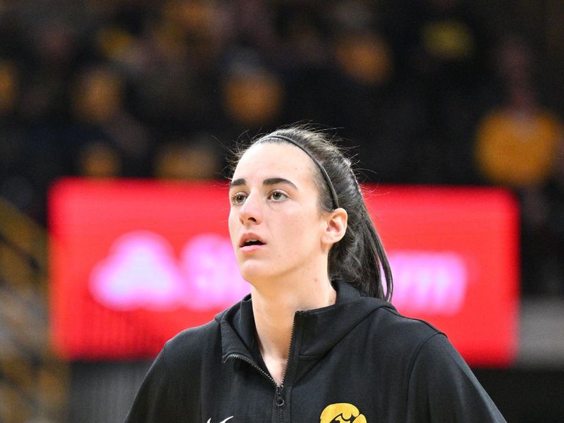 Mar 3, 2024; Iowa City, Iowa, USA; Iowa Hawkeyes guard Caitlin Clark (22) warms up before the game against the Ohio State Buckeyes at Carver-Hawkeye Arena. Clark is attempting to break the NCAA basketball all-time scoring record. Mandatory Credit: Jeffrey Becker-USA TODAY Sports