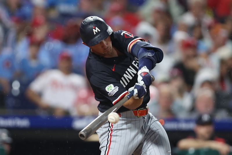 Sep 27, 2025; Philadelphia, Pennsylvania, USA; Minnesota Twins third base Brooks Lee (2) hits a single during the fourth inning against the Philadelphia Phillies at Citizens Bank Park. Mandatory Credit: Bill Streicher-Imagn Images