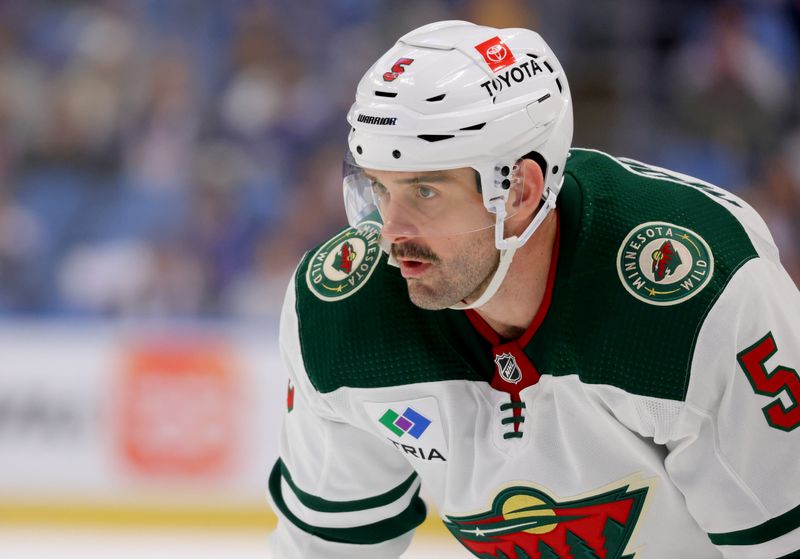 Nov 10, 2023; Buffalo, New York, USA;  Minnesota Wild defenseman Jake Middleton (5) waits for the face-off during the third period against the Buffalo Sabres at KeyBank Center. Mandatory Credit: Timothy T. Ludwig-USA TODAY Sports